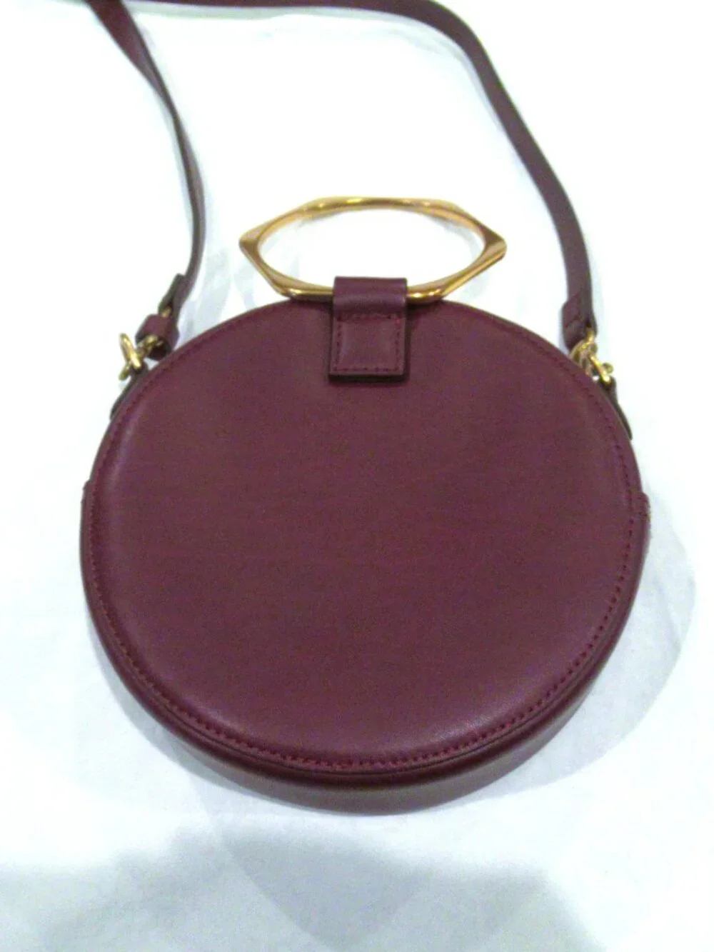 Thacker burgundy purse, both a crossbody and a bracelet handle